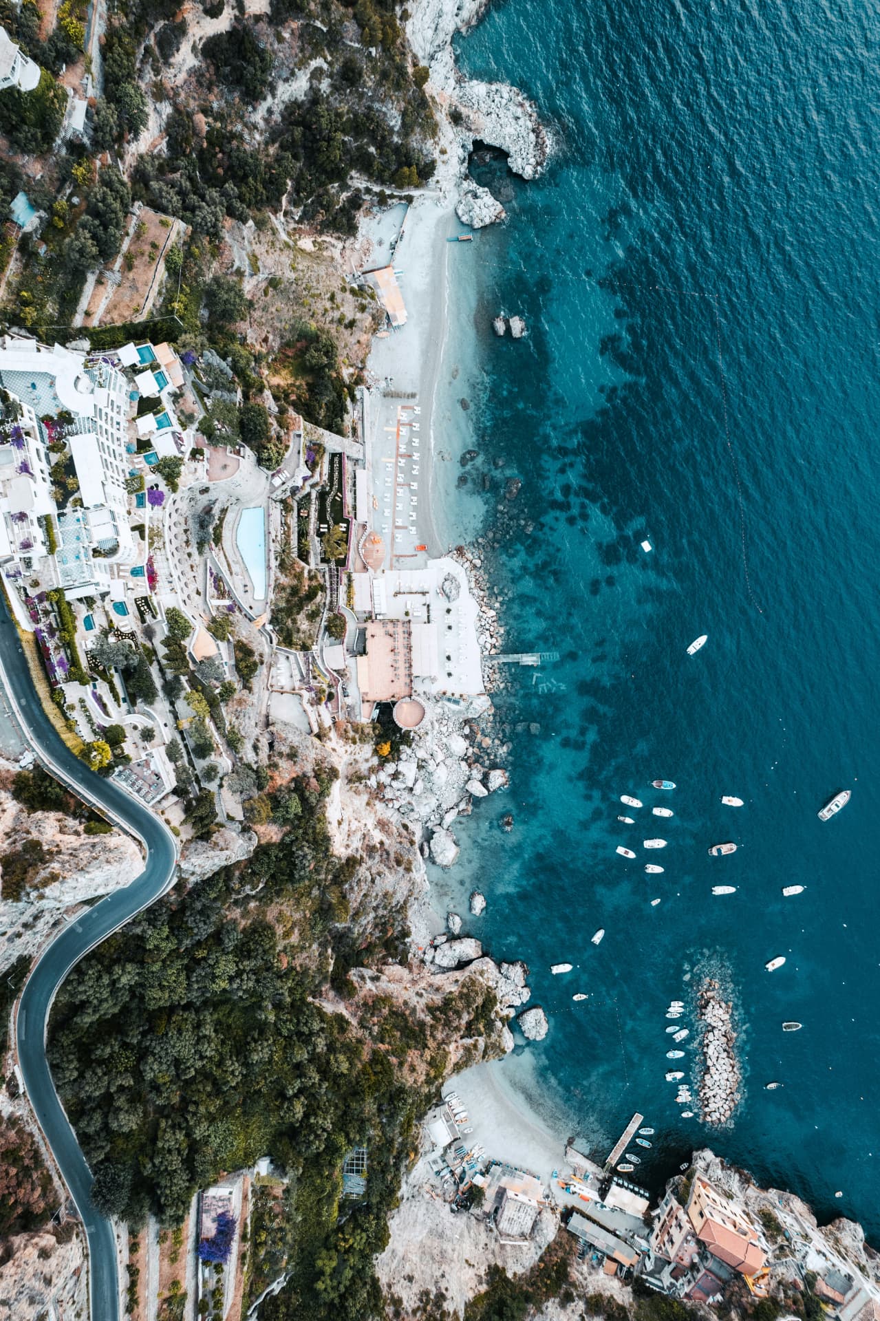 Aerial view of a Mediterranean coastal retreat and clear blue sea