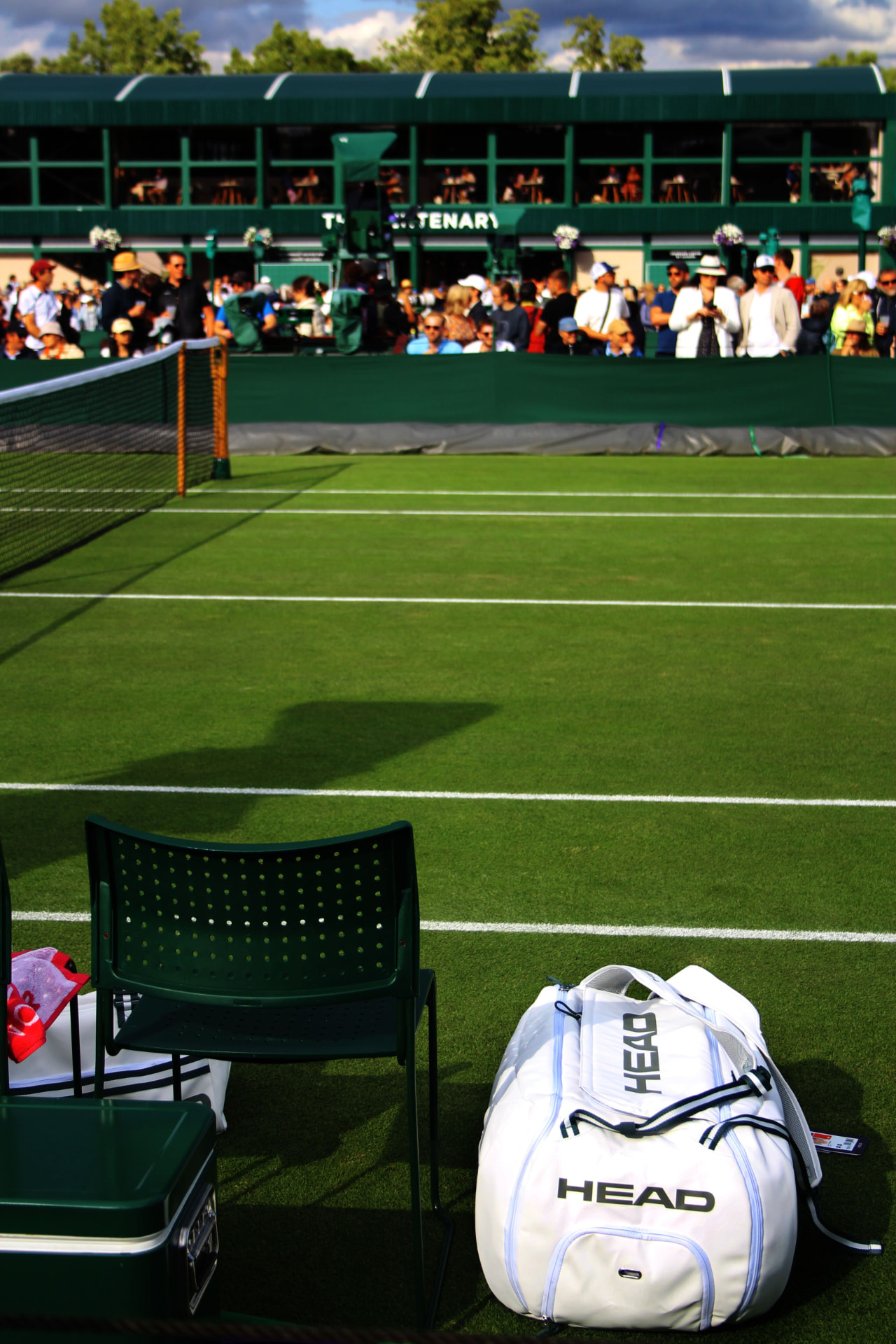 Courtside chair and kit bag beside the net