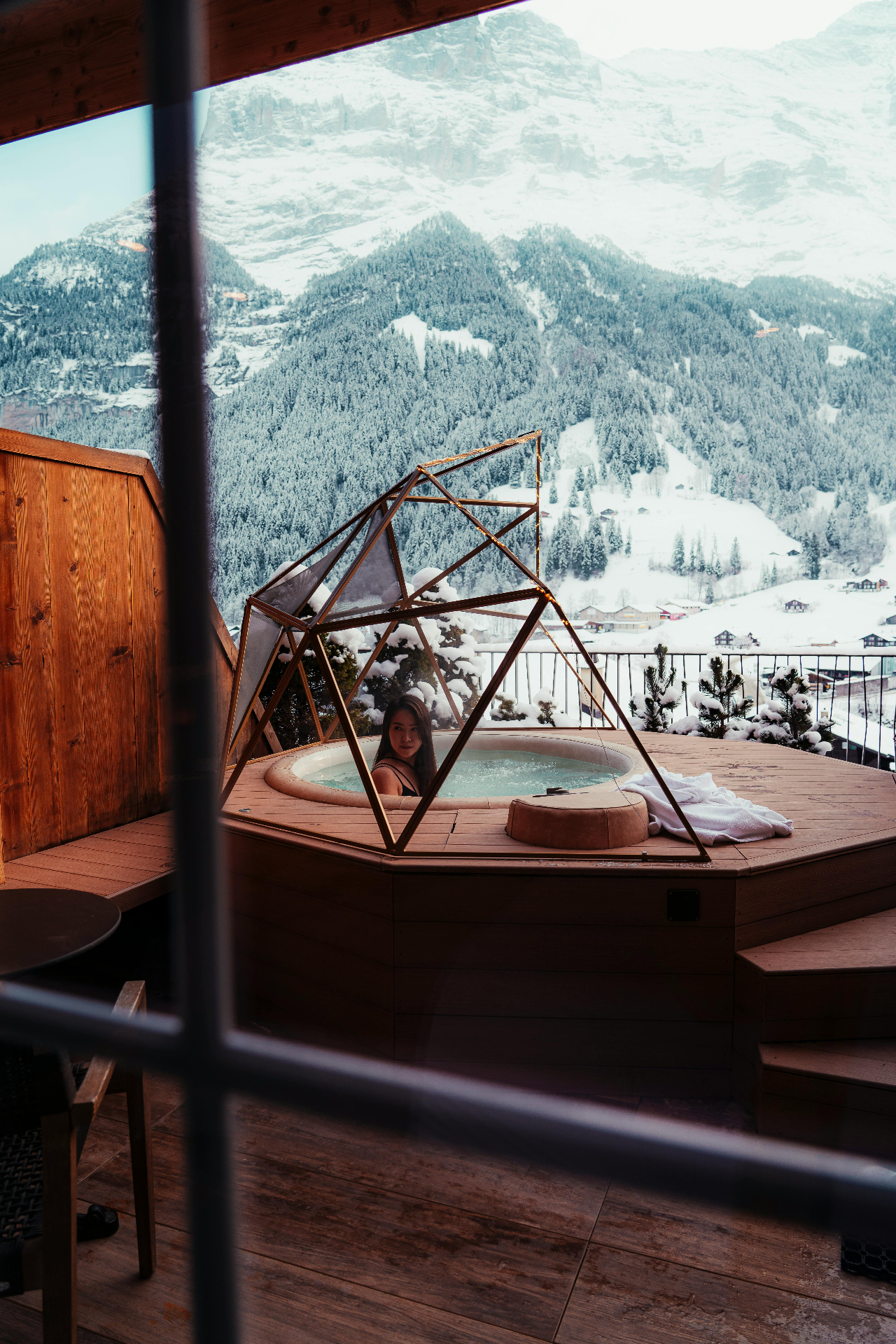 Hot tub overlooking snow-covered mountains